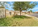Well maintained front yard and charming single-story home in a desirable community setting at 10546 E Topaz Cir, Scottsdale, AZ 85258