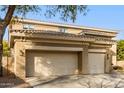Two-story house with three-car garage and neutral color scheme at 1078 W Spur Ct, Gilbert, AZ 85233