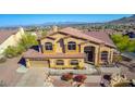Two-story home with tile roof, large windows, and city views at 14829 N 18Th Pl, Phoenix, AZ 85022