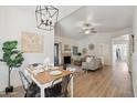 Charming dining area with a farmhouse table and stylish light fixture at 15050 N Thompson Peak Pkwy # 2033, Scottsdale, AZ 85260