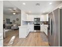 Modern kitchen with stainless steel appliances and white cabinetry at 15050 N Thompson Peak Pkwy # 2033, Scottsdale, AZ 85260