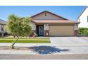 Charming curb appeal with a two-car garage at 17198 W Fetlock Trl, Surprise, AZ 85387