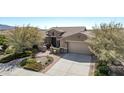 Single-story home with landscaped yard and two-car garage at 18111 W Desert Sage Dr, Goodyear, AZ 85338