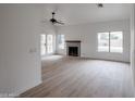 Bright living room boasts wood-look floors, fireplace, and pool view at 18429 N 16Th Way, Phoenix, AZ 85022