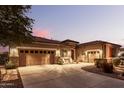 Spacious home with a three-car garage and inviting front entrance at 19000 E Old Beau Trl, Queen Creek, AZ 85142