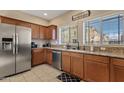 Modern kitchen with stainless steel appliances and granite countertops at 2150 W Alameda Rd # 1313, Phoenix, AZ 85085