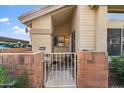 Front entry with gated patio and brick accents at 2201 N Comanche Dr # 1075, Chandler, AZ 85224