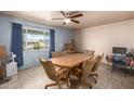 Dining room featuring a large wooden table with six chairs and a bright window view at 2315 W Butler Dr, Phoenix, AZ 85021