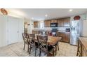 Bright kitchen with ample cabinetry and a dining area at 2363 W Daniel Rd, Queen Creek, AZ 85144