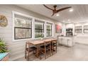 Bright dining area with a wooden table and four chairs at 250 N Neary Ave, Superior, AZ 85173