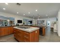 Spacious kitchen with large island, modern appliances, and wine refrigerator at 3601 N 55Th Pl, Phoenix, AZ 85018