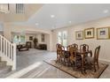 Elegant dining room with wood table and access to living room at 4103 E Mead Way, Chandler, AZ 85249