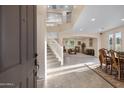 Bright entryway with staircase and views of living and dining areas at 4103 E Mead Way, Chandler, AZ 85249