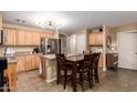 Bright kitchen with light wood cabinets and an island at 45331 W Applegate Rd, Maricopa, AZ 85139