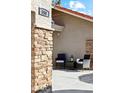 Inviting front entry with brick detailing and comfortable seating area at 500 E Encinas Ave, Gilbert, AZ 85234
