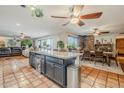 Spacious kitchen with granite countertops, island, and stainless steel appliances at 5301 E Mitchell Dr, Phoenix, AZ 85018