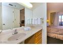 Clean bathroom with a vanity and a view into the bedroom at 7350 N Pima Rd # 252, Scottsdale, AZ 85258