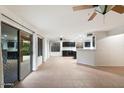 Open living space with access to the kitchen and backyard at 7447 E Christmas Cholla Dr, Scottsdale, AZ 85255