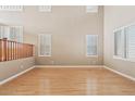 Living room with hardwood floors and abundant natural light at 7603 W Encinas Ln, Phoenix, AZ 85043