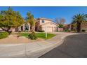 Two-story house with a two-car garage and nicely landscaped yard at 10921 W Bermuda Dr, Avondale, AZ 85392