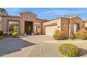 Beautiful desert home with a large driveway and mature landscaping at 14204 N Bursage Dr, Fountain Hills, AZ 85268