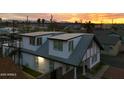 Two-story home with a rooftop deck, showcasing city views at 1521 W Garfield St, Phoenix, AZ 85007