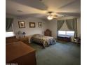 Cozy bedroom with carpeted floors and ample natural light at 1534 E Alba Dr, Casa Grande, AZ 85122