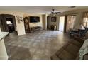 Bright and airy living room with tile flooring and access to backyard at 1534 E Alba Dr, Casa Grande, AZ 85122