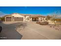 House with a three-car garage and a covered patio at 16548 E Emerald Dr, Fountain Hills, AZ 85268