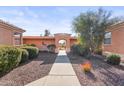 Shared pathway with arched entryway and desert landscaping at 17216 E Salida Dr # B, Fountain Hills, AZ 85268