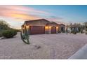 Stunning desert landscape surrounds this single-story home with a three-car garage at 28370 N 113Th Way, Scottsdale, AZ 85262