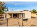 House exterior with walkway and chain link fence at 3640 W Garfield St, Phoenix, AZ 85009