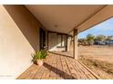 Covered porch with brick flooring and potted plants at 3640 W Garfield St, Phoenix, AZ 85009