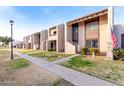 Row of two-story townhomes with a shared walkway and landscaping at 4303 W Solano N Dr, Glendale, AZ 85301