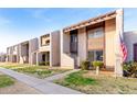 Row of two-story townhomes with a shared walkway and landscaping at 4303 W Solano N Dr, Glendale, AZ 85301