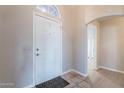 Interior entryway with tiled flooring and a view into the living area at 470 E Echo Ln, Florence, AZ 85132