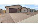 New construction home with a brick paver driveway at 5030 W Hunter Trl, San Tan Valley, AZ 85144