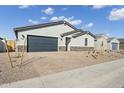 Charming single-story home with a paver driveway and low maintenance landscaping at 5030 W Hunter Trl, San Tan Valley, AZ 85144