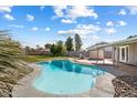 Relaxing kidney-shaped pool and patio area in a backyard setting at 527 N Valencia Pl, Chandler, AZ 85226