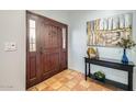 Bright entryway with tile flooring and wooden door at 7313 E Pleasant E Run, Scottsdale, AZ 85258