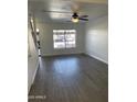 Spacious living room with grey vinyl flooring and ceiling fan at 7801 N 44Th Dr # 1183, Glendale, AZ 85301