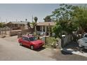 Single story home with a red car parked in front at 8050 S Calle Maravilla --, Guadalupe, AZ 85283