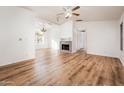 Bright living room featuring a fireplace and wood-look floors at 8300 E Via De Ventura Rd # 2006, Scottsdale, AZ 85258