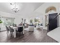 Open concept living and dining area with hardwood floors and modern furniture at 9144 E Pershing Ave, Scottsdale, AZ 85260