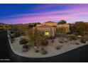 Aerial view of a beautiful home in a desert landscape at 10874 E Dale Ln, Scottsdale, AZ 85262