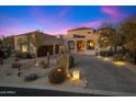 Stunning desert home with a long driveway and landscaping at 10874 E Dale Ln, Scottsdale, AZ 85262