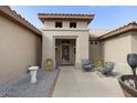 Front entry with seating area and desert landscaping at 16036 W Sandia Park Dr, Surprise, AZ 85374