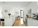 Modern white kitchen with stainless steel appliances at 1717 N 1St Ave # 215, Phoenix, AZ 85003