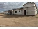 Back of new construction home showing covered patio at 21032 W Skinner Rd, Wittmann, AZ 85361