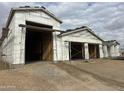 New construction home with two car garage and desert landscaping at 21032 W Skinner Rd, Wittmann, AZ 85361